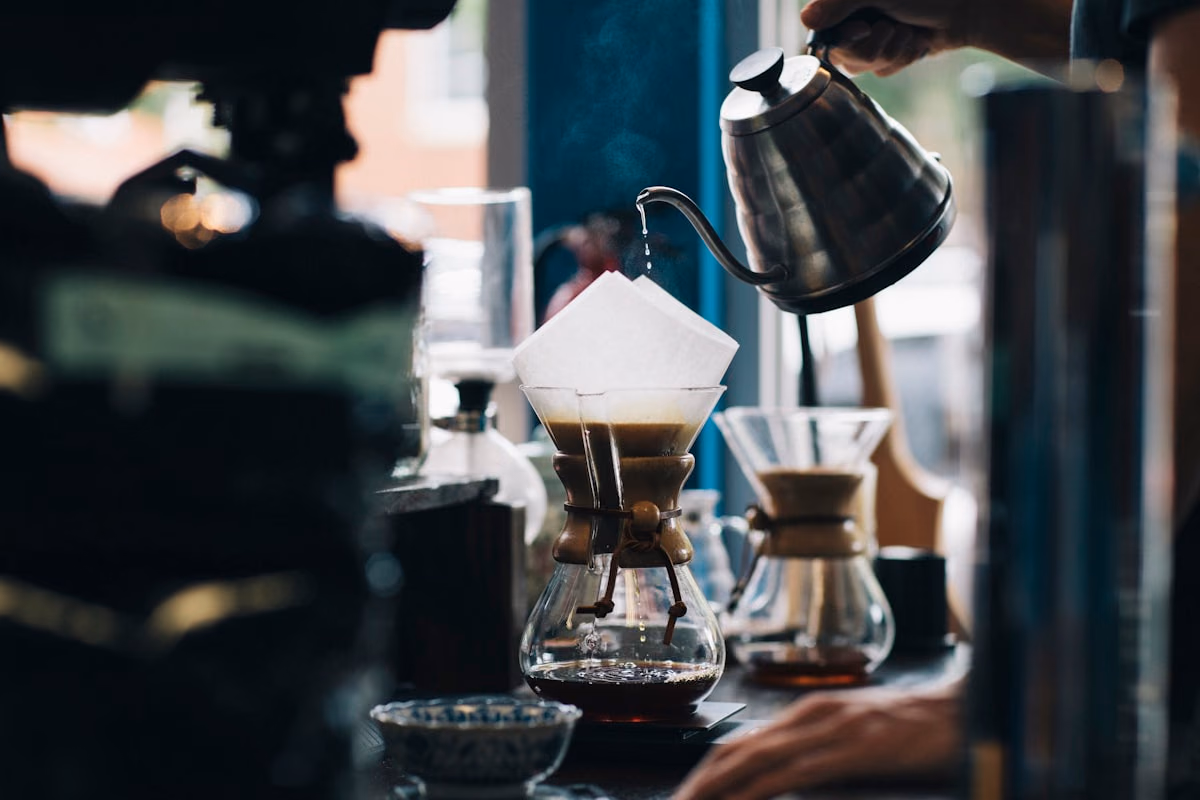 Coffee shop barista preparing specialty drinks.