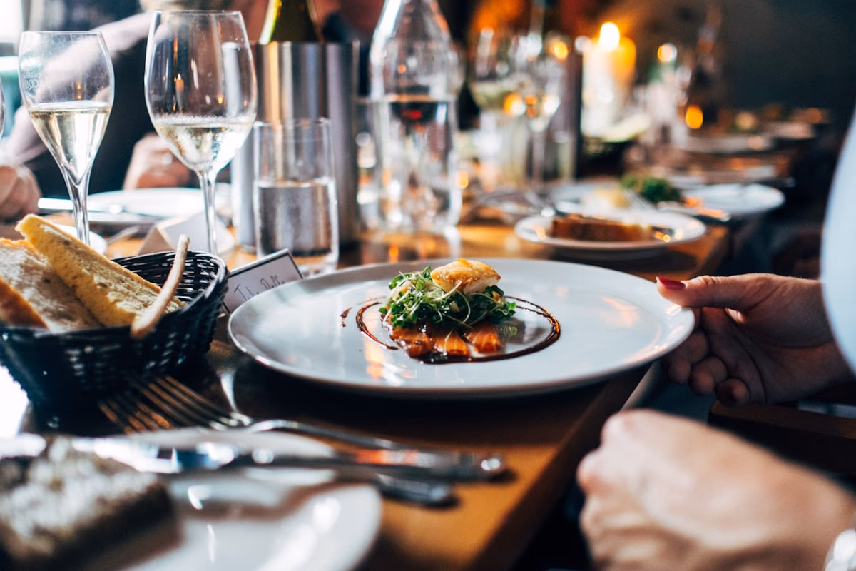 Cozy bistro dining space and plated culinary dishes.